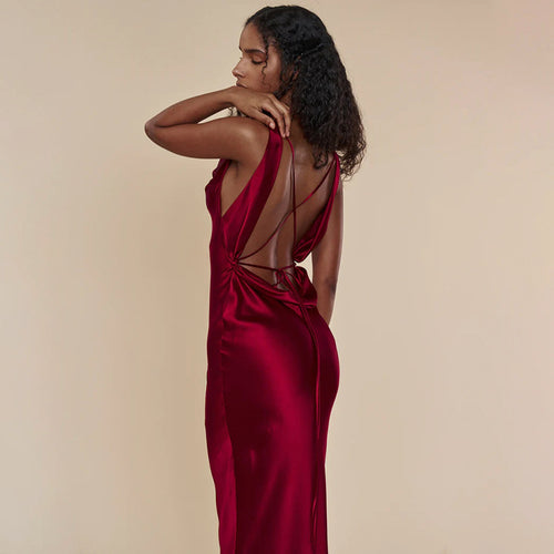 Woman wearing backless lace-up evening gown
