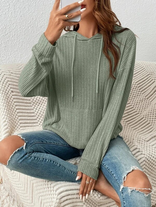 Woman wearing drawstring hooded pullover sweatshirt