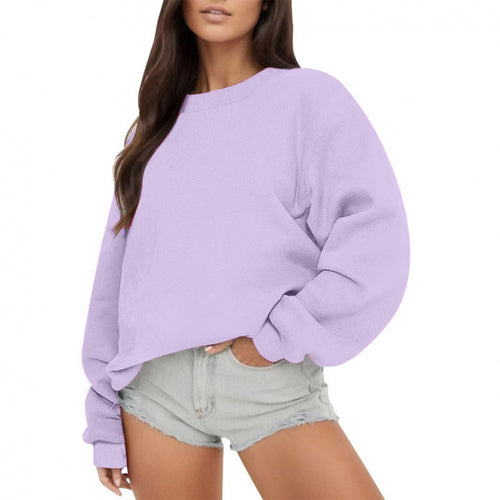 Woman wearing loose crew neck sweatshirt