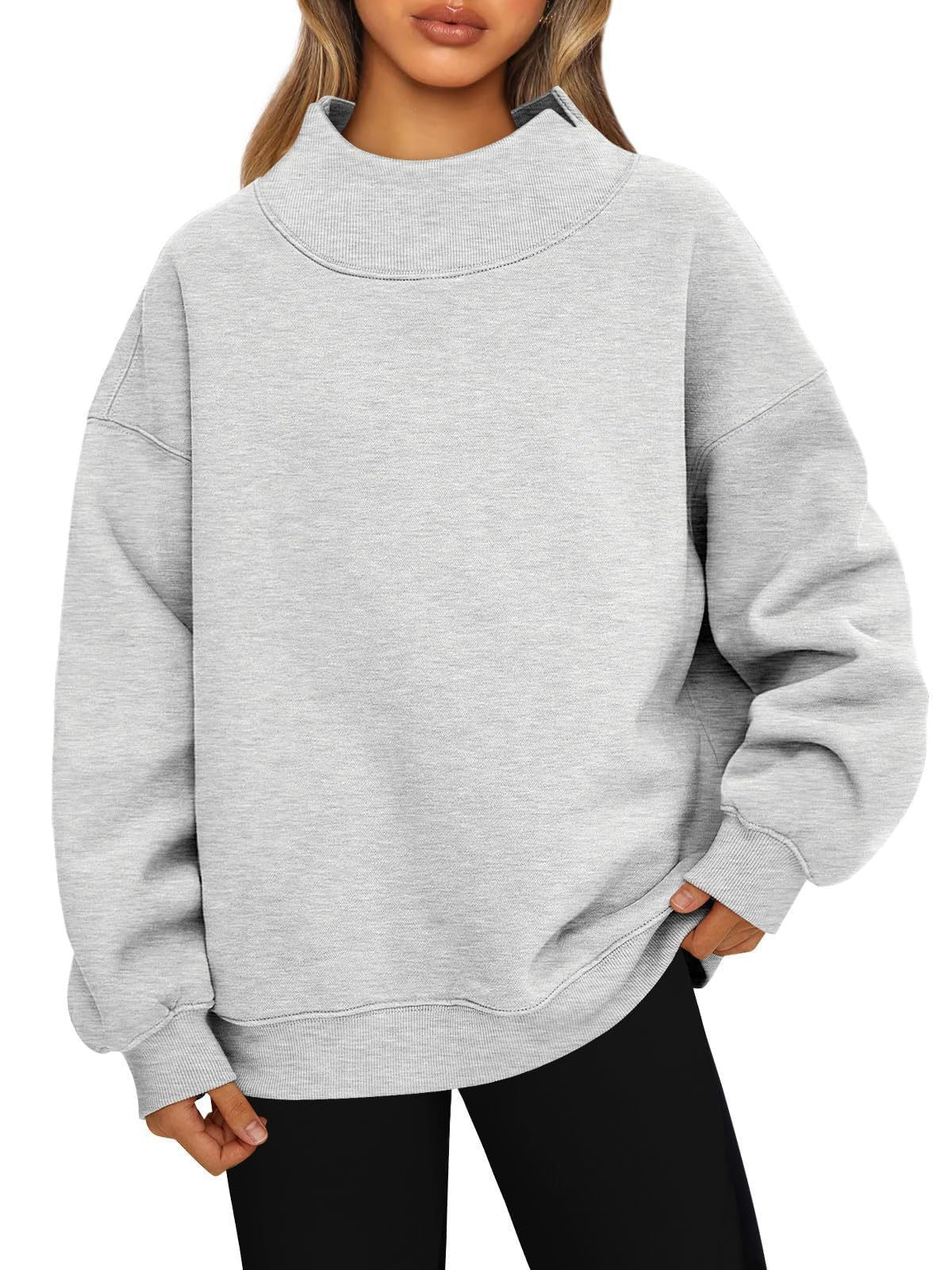 Woman wearing fleece-lined high neck pullover sweatshirt