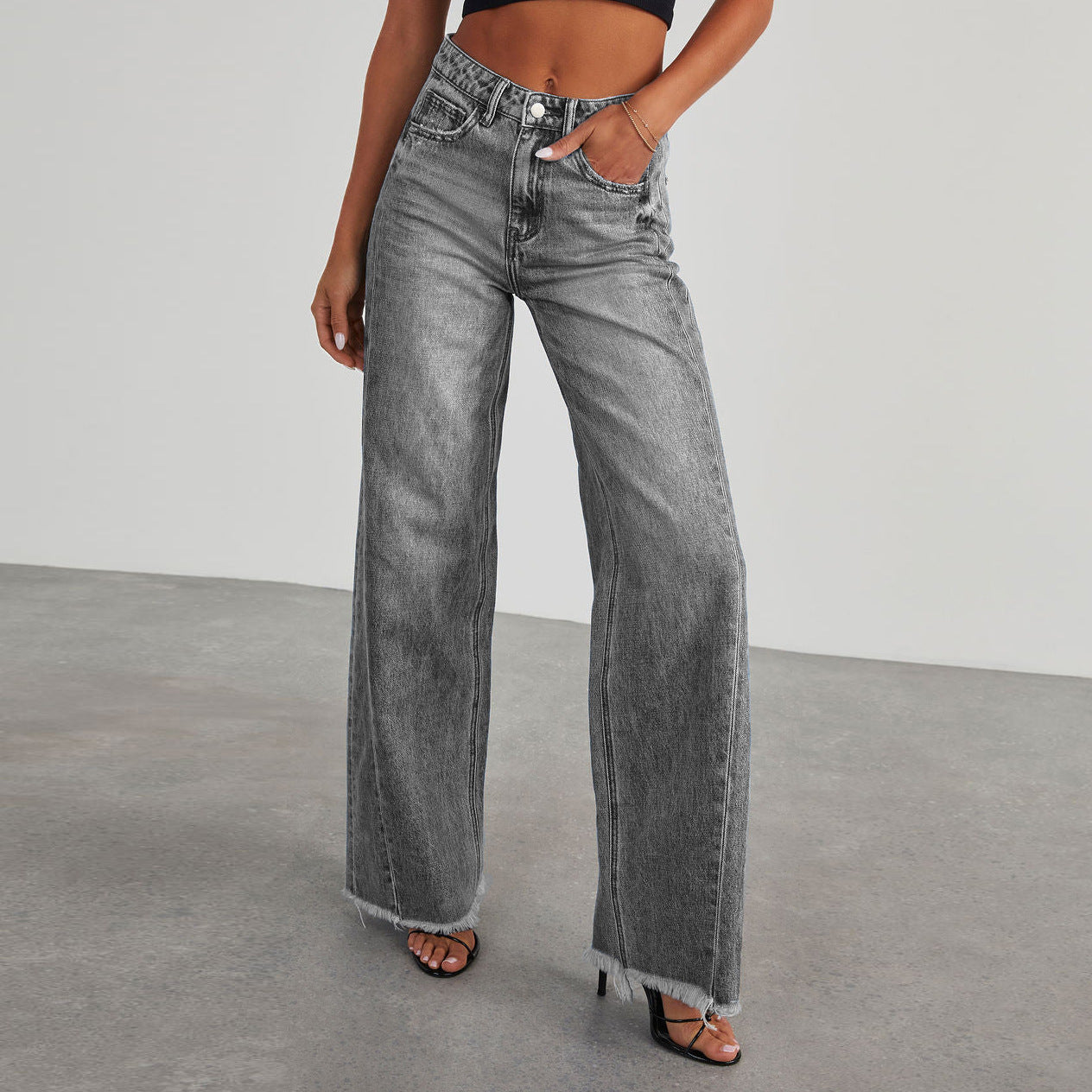Close-up of denim fabric texture on wide-leg jeans