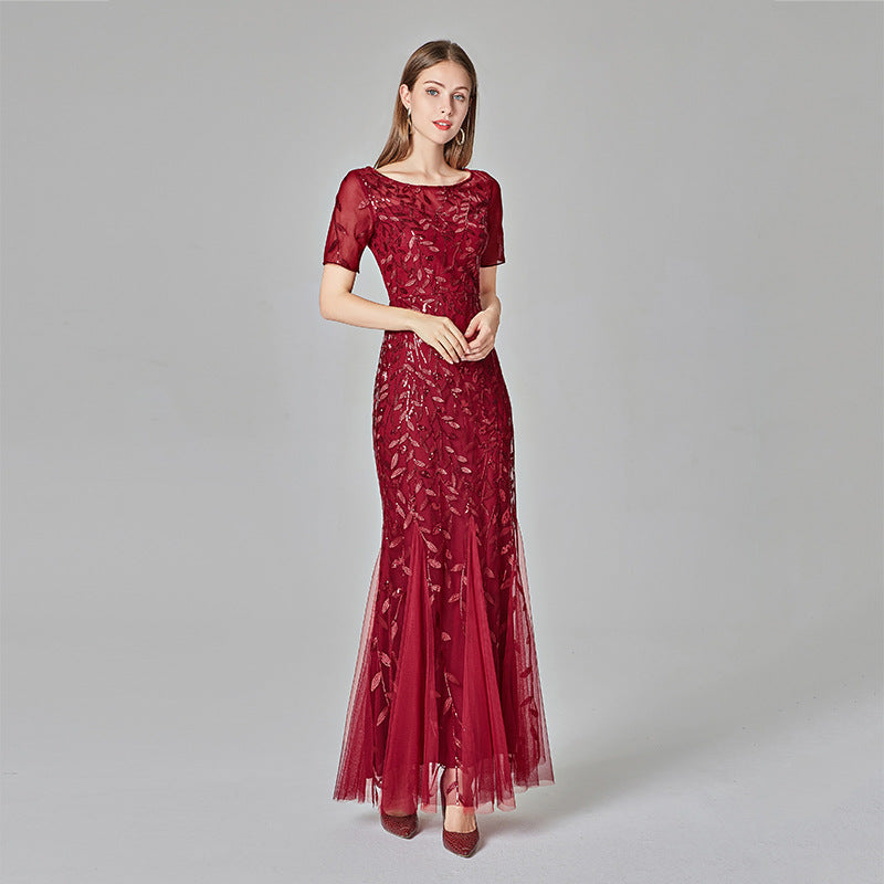Woman wearing plus size fishtail evening gown