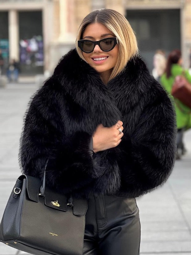 Woman wearing plush winter coat, styled look
