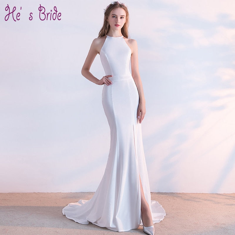 Woman wearing red fishtail halter evening gown