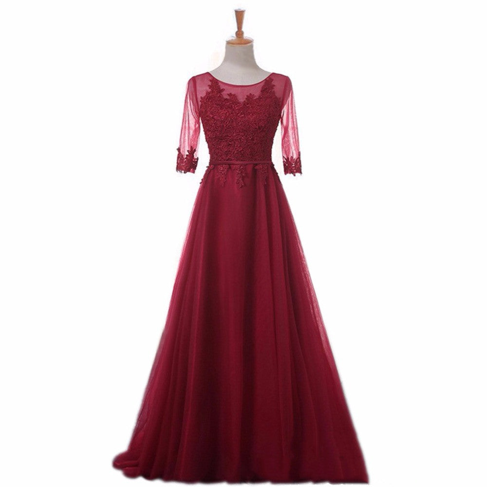 Woman wearing red mesh long formal evening gown