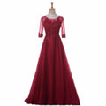 Woman wearing red mesh long formal evening gown
