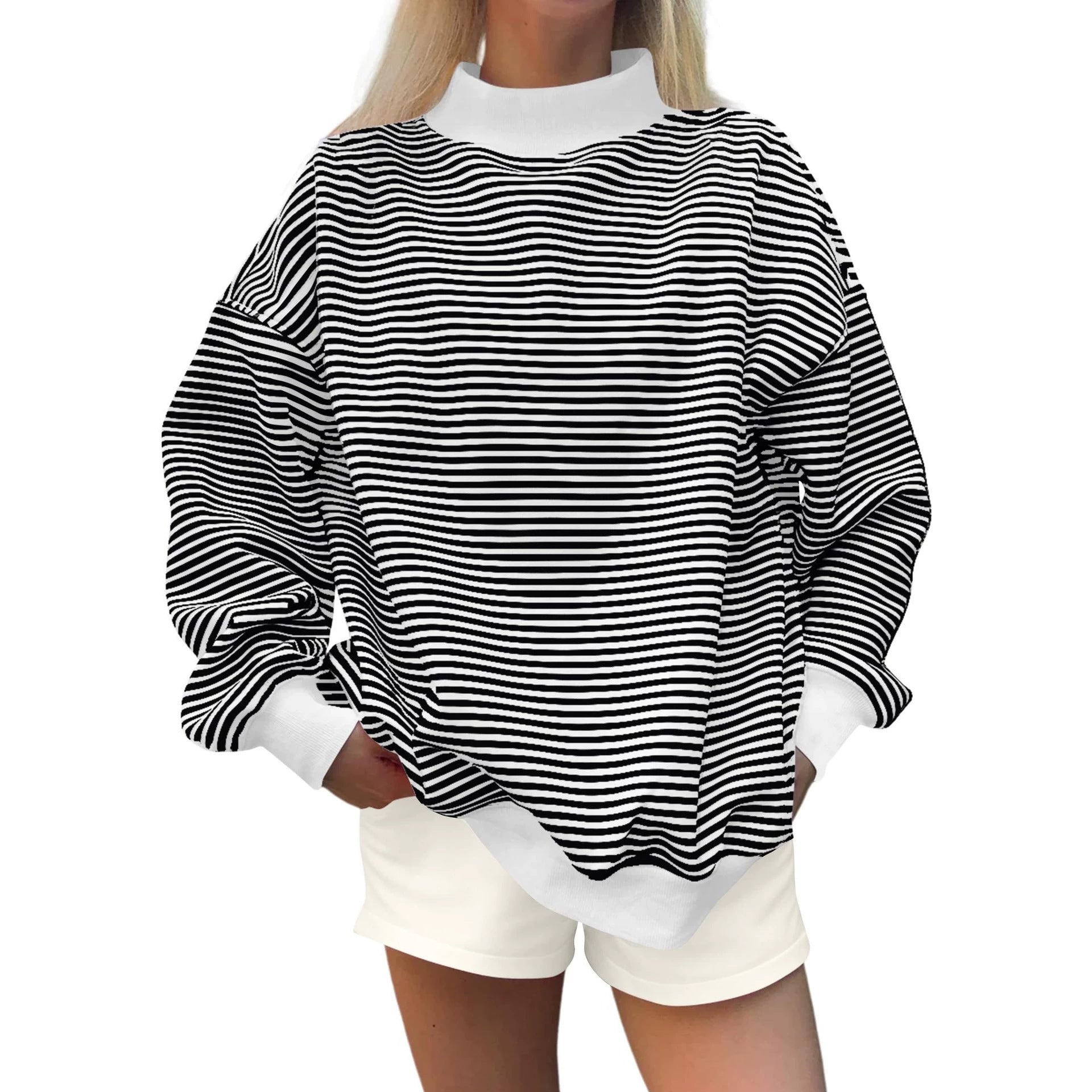Woman wearing striped crewneck sweatshirt, casual fall style