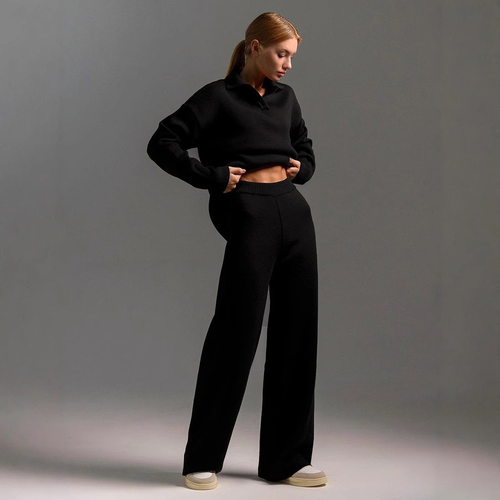 Woman wearing black mock neck sweater with wide-leg pants outfit