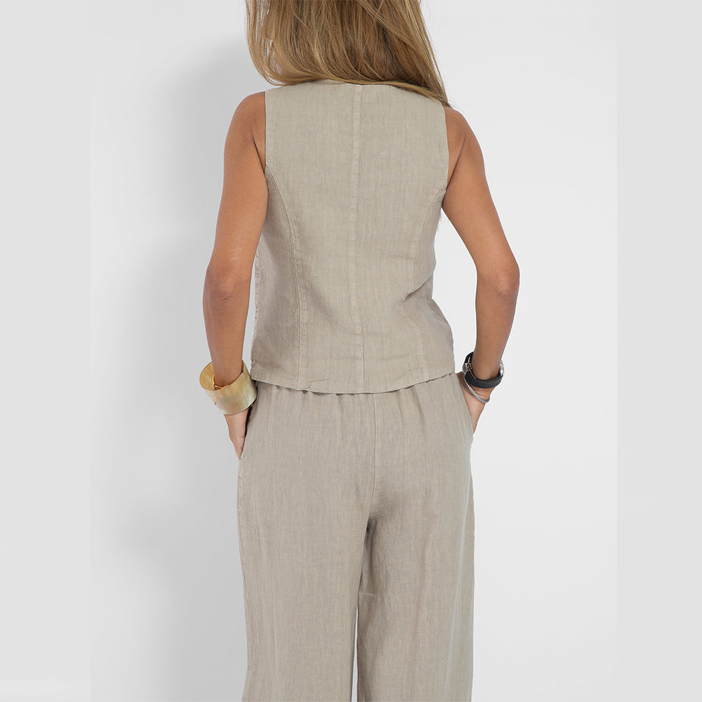 Woman wearing V-neck vest and straight trouser set